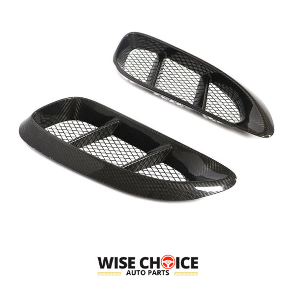 A pair of glossy Porsche 718 Carbon Fiber Side Vents against a white background.