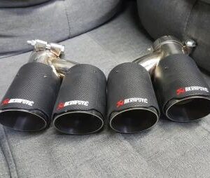 Akrapovic Quad Conversion Carbon Tip Set displayed on a vehicle.