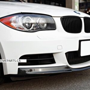 A close-up of the E82 MTech Carbon Fiber Lip designed for 2008-2013 BMW 1 Series, showcasing its sleek design and high-quality material.