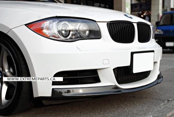 A close-up of the E82 MTech Carbon Fiber Lip designed for 2008-2013 BMW 1 Series, showcasing its sleek design and high-quality material.