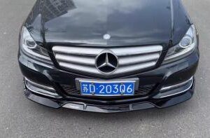 Glossy Brabus Look Front Lip for 2012-2014 W204 C300 and C350, showcasing its sleek design.