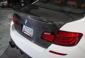 2011-2016 F10 Carbon CSL Trunk Lid in clear coat finish, showcasing real carbon fiber design.