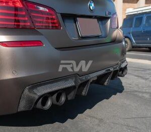 A close-up view of the F10 M5 Carbon Diffuser showcasing its real carbon fiber construction and matte finish.