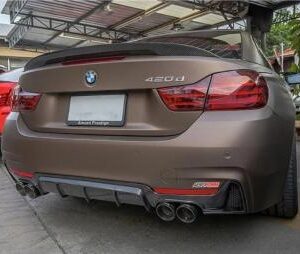 High-quality real carbon fiber quad performance diffuser for BMW F32 F33 F36 models, showcasing a clear coat finish.