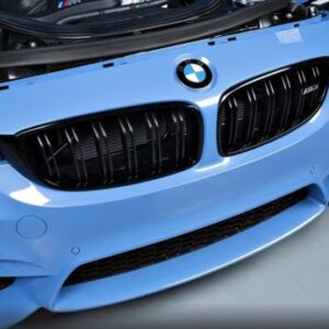 Glossy black grills for BMW F80 and F82 models, enhancing front-end appearance and airflow.