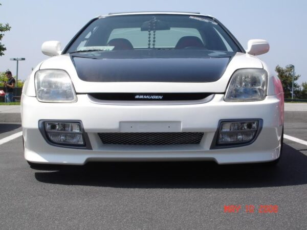 A high-quality image of the 1997-2001 Honda Prelude Mugen Front Bumper made of Ultraflex material, unpainted, with mesh included