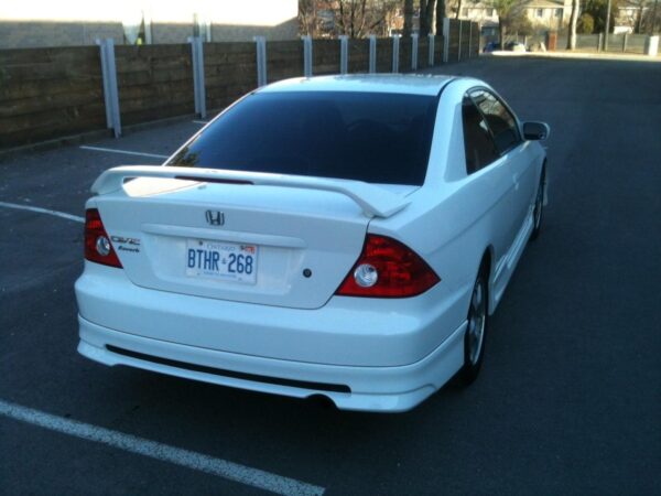 A flat black Reverb Style Rear Lip designed for 2001-2005 Honda Civic 2DR and 4DR models, showcasing its sleek and aerodynamic profile.