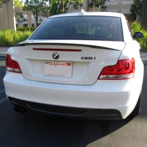 A sleek M Performance Trunk Spoiler designed for the BMW 1 Series (2008-2013) in real carbon fiber.