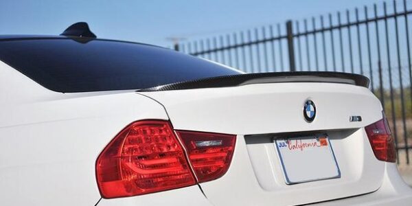 E90 Performance Carbon Spoiler for 2006-2011 BMW 4DR models, showcasing its sleek design and UV clear coat finish