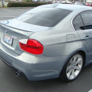 E90 M3 Look Trunk Spoiler for BMW 323, 325, 328, 335, and M3 4DR models, unpainted plastic with 3M tape included for easy installation.