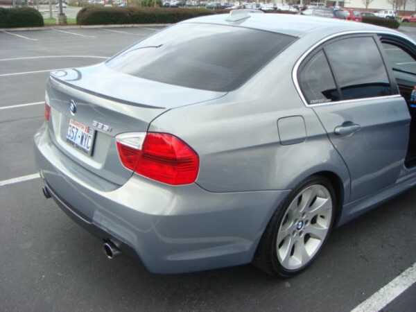 E90 M3 Look Trunk Spoiler for BMW 323, 325, 328, 335, and M3 4DR models, unpainted plastic with 3M tape included for easy installation.