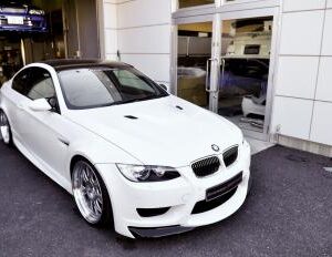 E92 E93 Ericsson Amuse Front Bumper with Carbon Splitters, primed for paint.